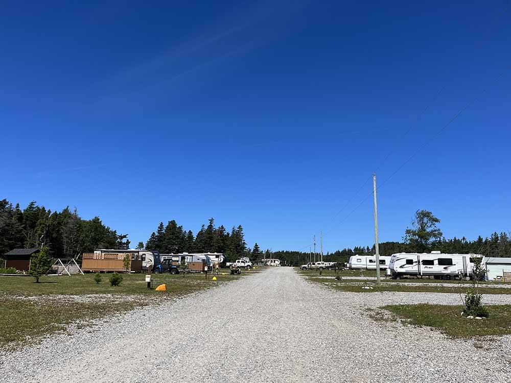 Gravel road entering the campsites at PIRATE'S HAVEN RV PARK & CHALETS