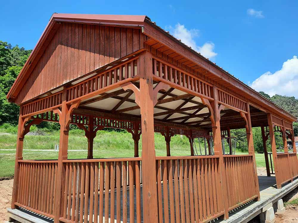 A red wooden pavilion at 4 GUYS RV PARK