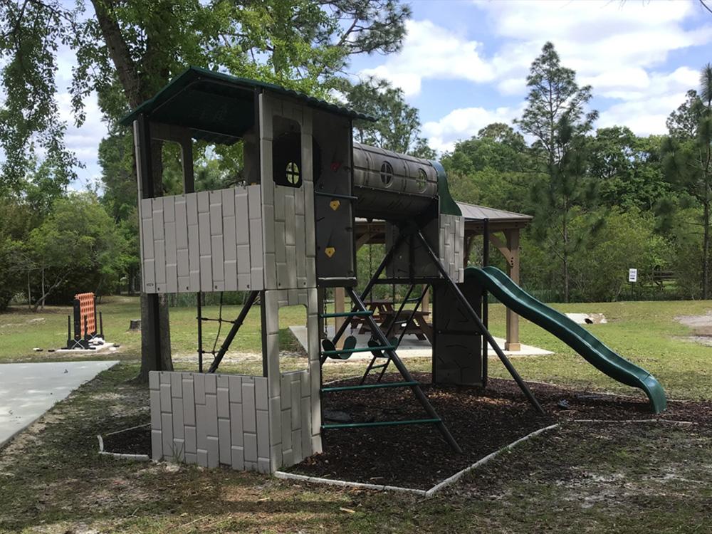 The children's playground at OKEFENOKEE PASTIMES CABINS & CAMPGROUND