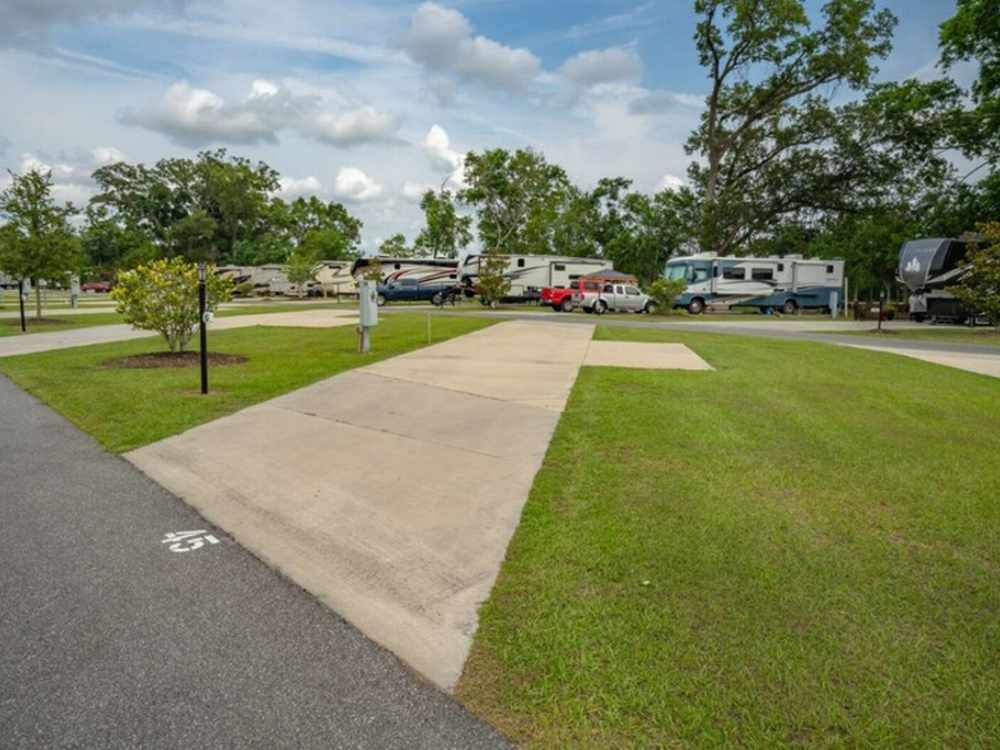 Grass next to the site at Southern Leisure RV Resort