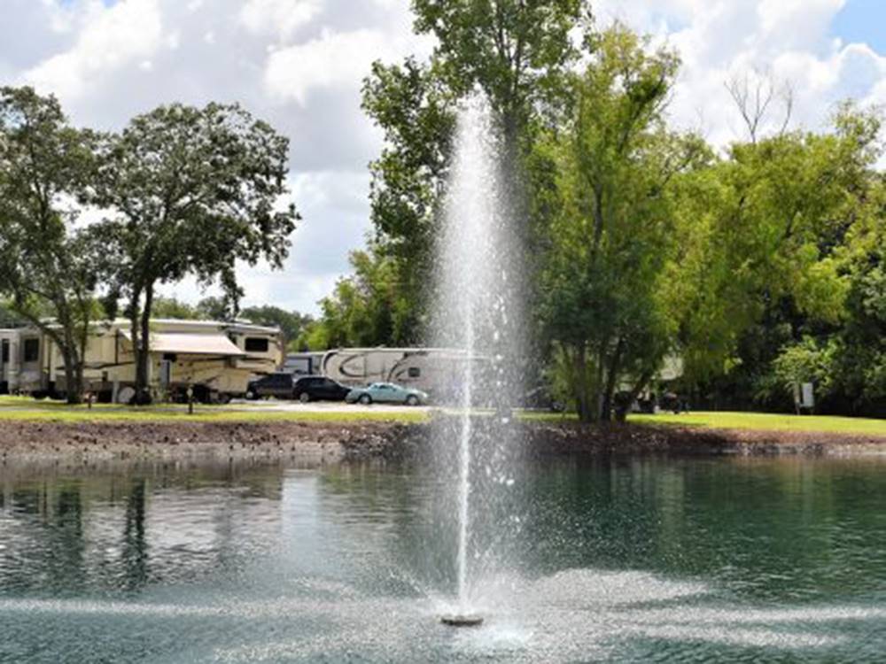 The pond with a fountain at Stonebridge RV Park & Resort