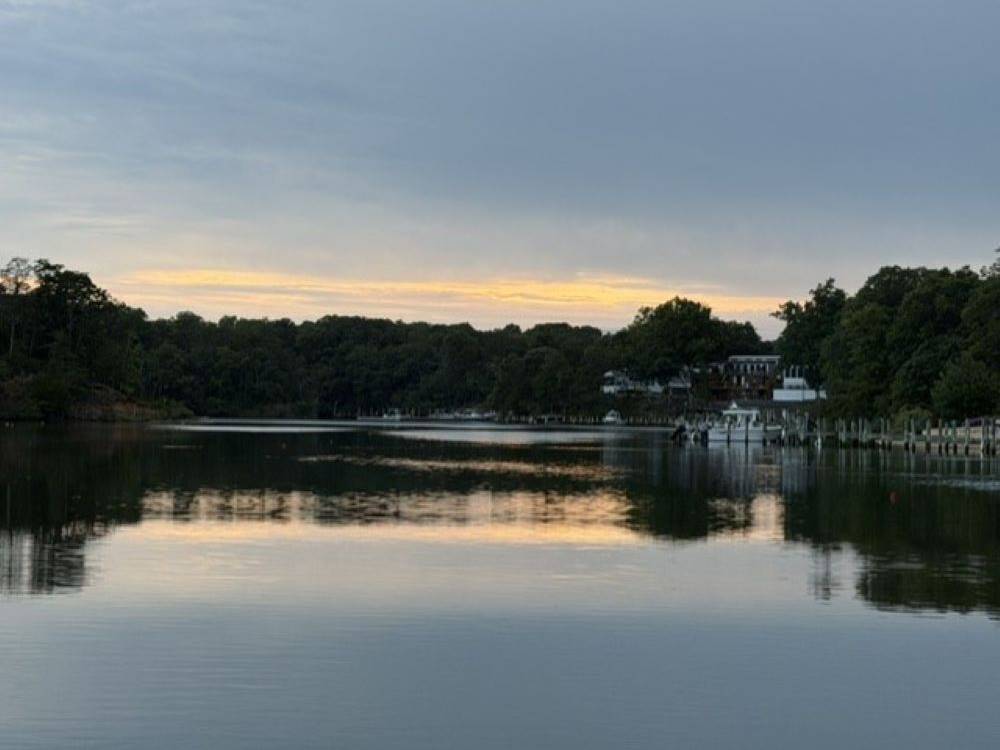 The sun sets over the water