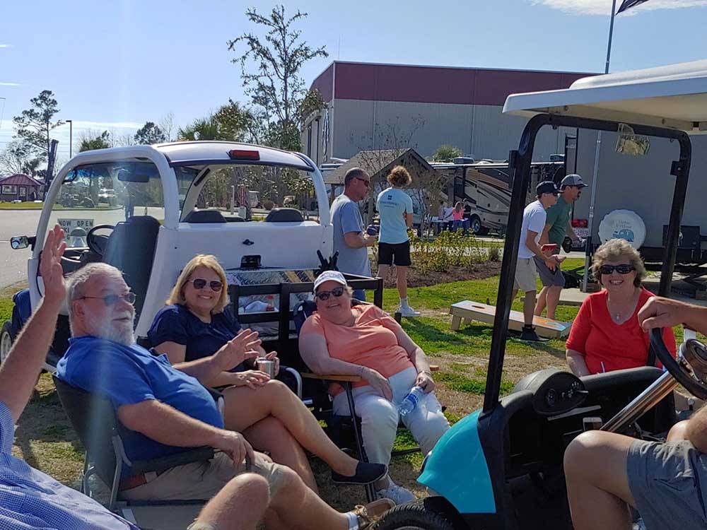 Friends gathered in camping chairs at NMB RV RESORT AND DRY DOCK MARINA