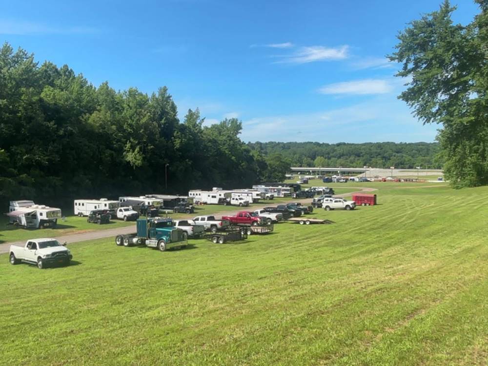 Trucks and trailers parked in a field