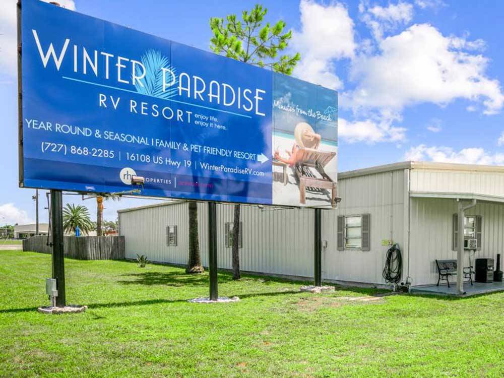 A large billboard promoting the business at WINTER PARADISE RV RESORT