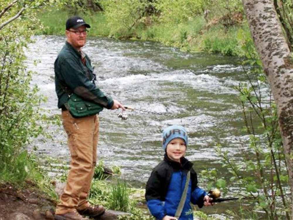 A father and son fishing at HAT CREEK RESORT & RV PARK
