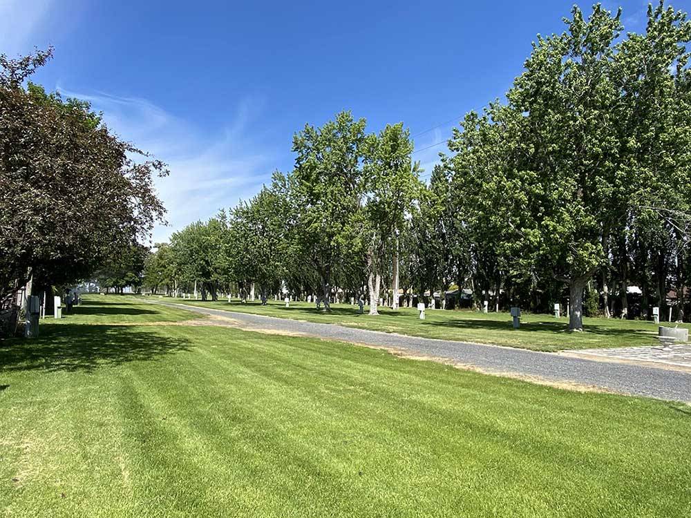 Campsites surrounded by trees at GRANT COUNTY FAIRGROUNDS & RV PARK