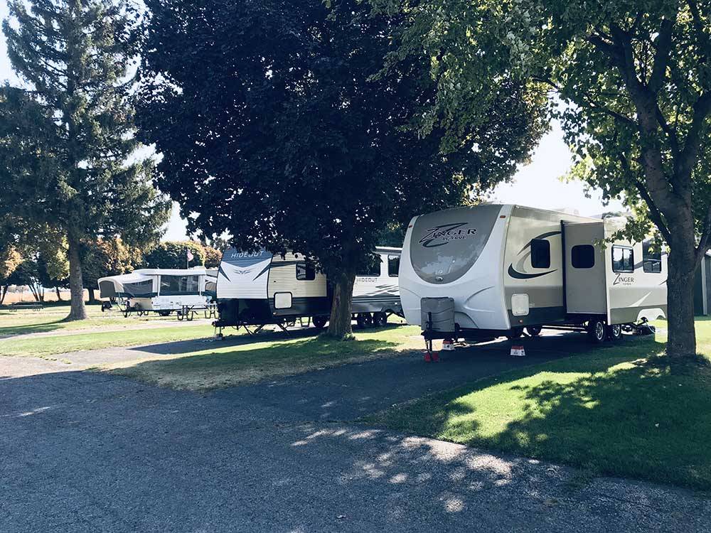 A row of paved RV sites at GOOSE CREEK RV PARK & CAMPGROUND