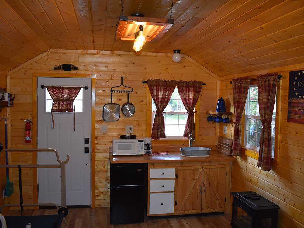 The kitchen area in the rental cabin at GOOSE CREEK RV PARK & CAMPGROUND