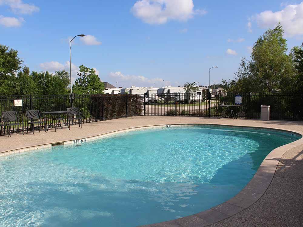 The swimming pool area at BAYOU BEND RV RESORT