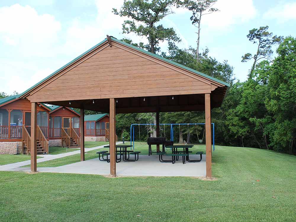 The pavilion with picnic tables at BAYOU BEND RV RESORT