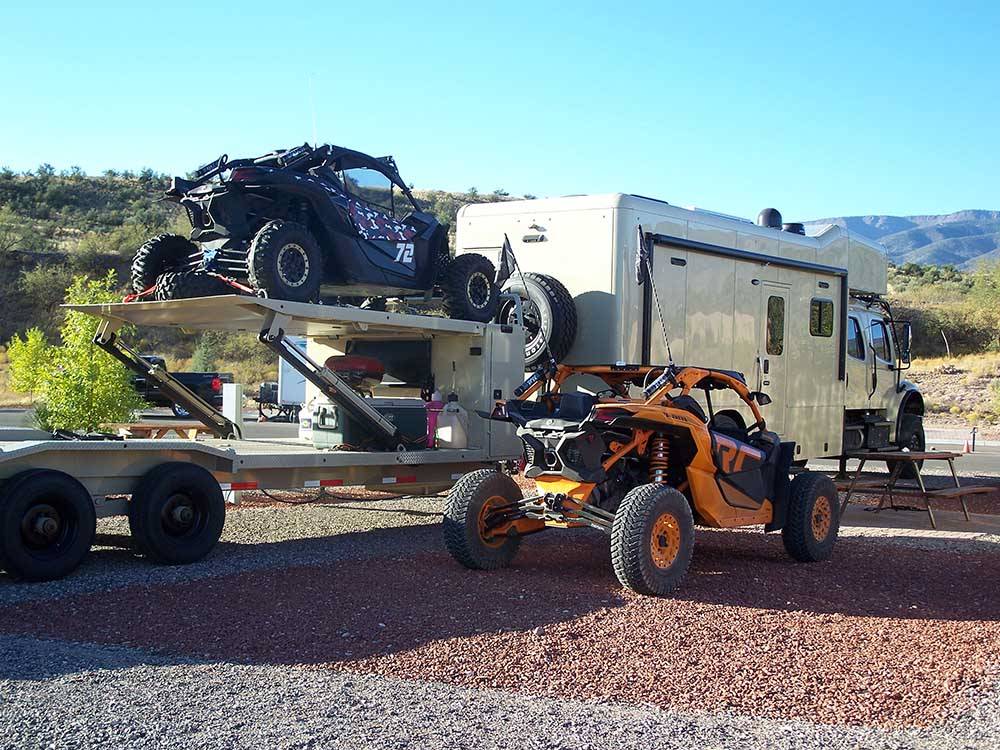 An assortment of off road vehicles at a RV site at RAIN SPIRIT RV RESORT