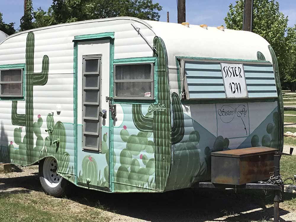 A painted travel trailer at OAKDALE PARK