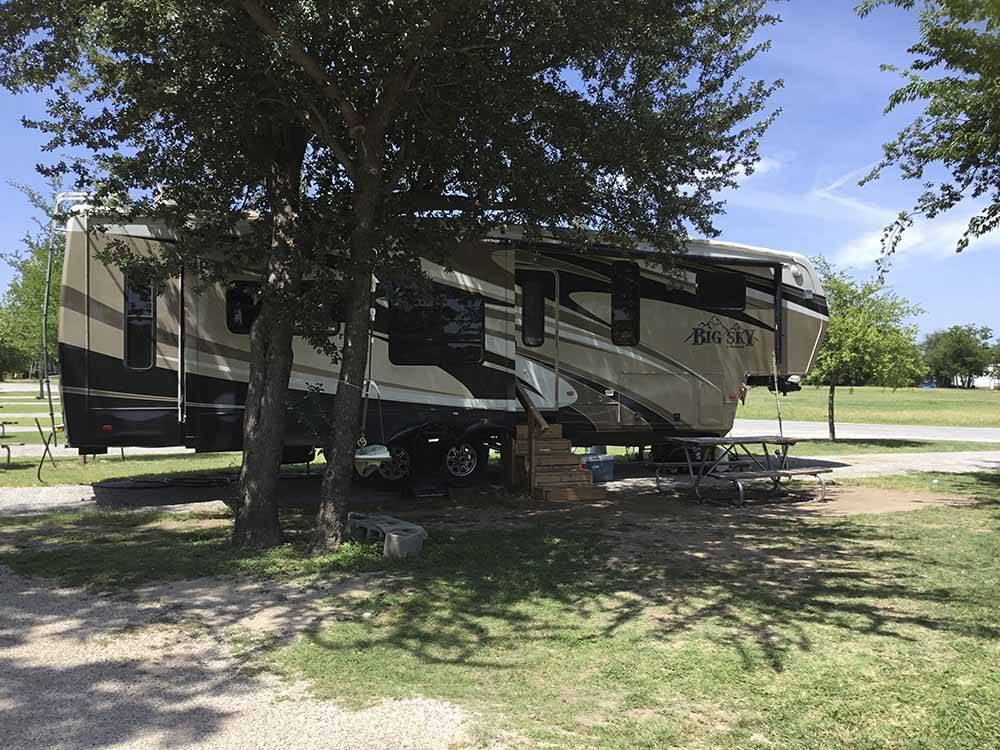 A fifth wheel trailer in an RV site at OAKDALE PARK