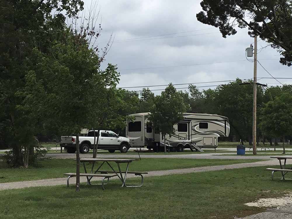 A picnic table by an RV site at OAKDALE PARK