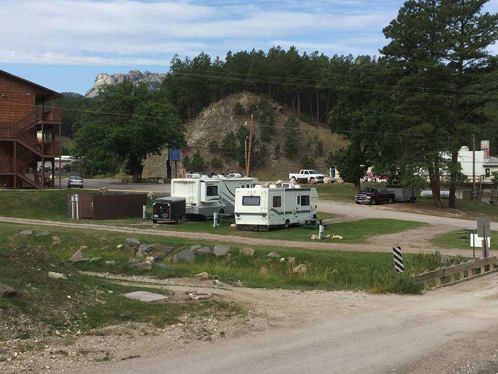 A view of the gravel roads and campsites at RUSHMORE VIEW RV PARK