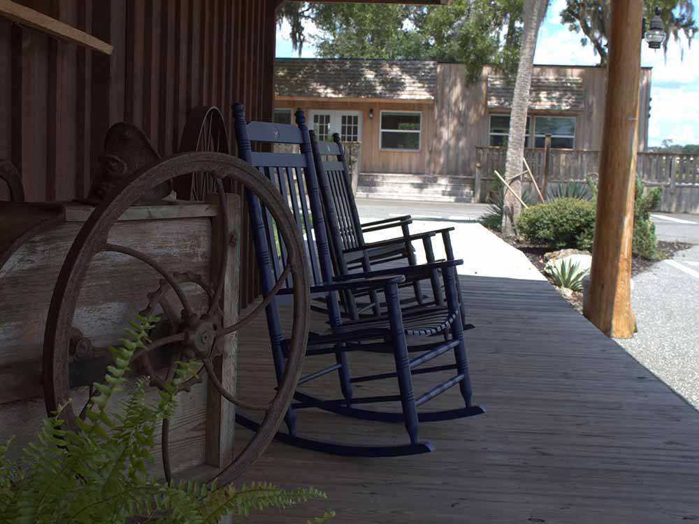 A couple of rocking chairs at WILDWOOD RV VILLAGE
