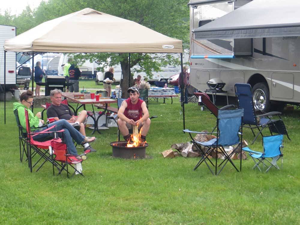 Family camping in RV at RIVERSIDE CAMPING & RV RESORT