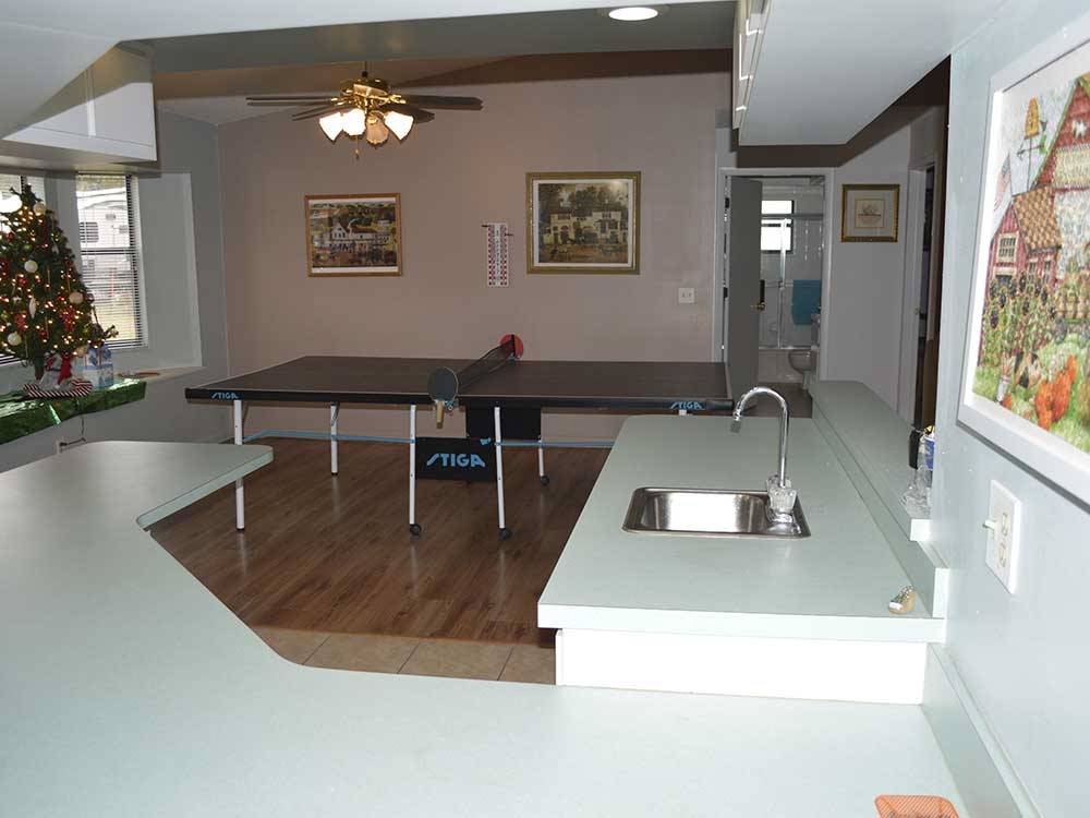 Ping pong in game room at BREEZY OAKS RV PARK