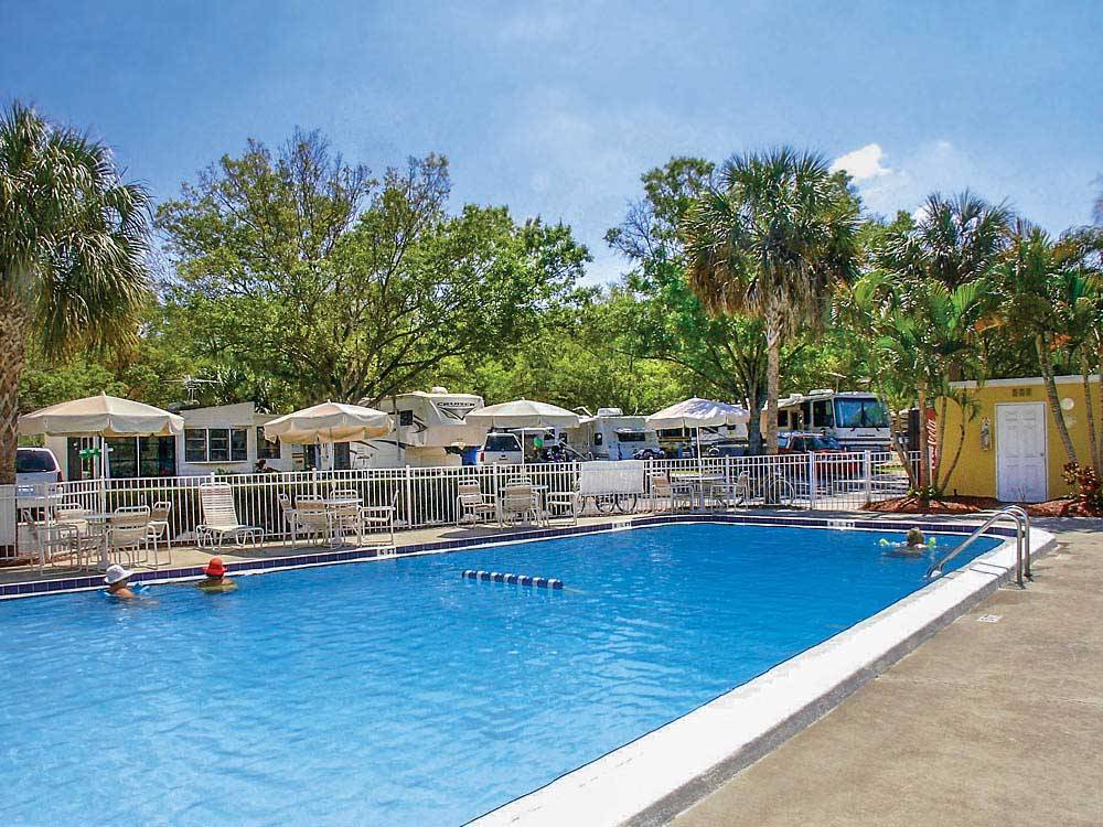 Swimming pool with outdoor seating at ENCORE VACATION VILLAGE