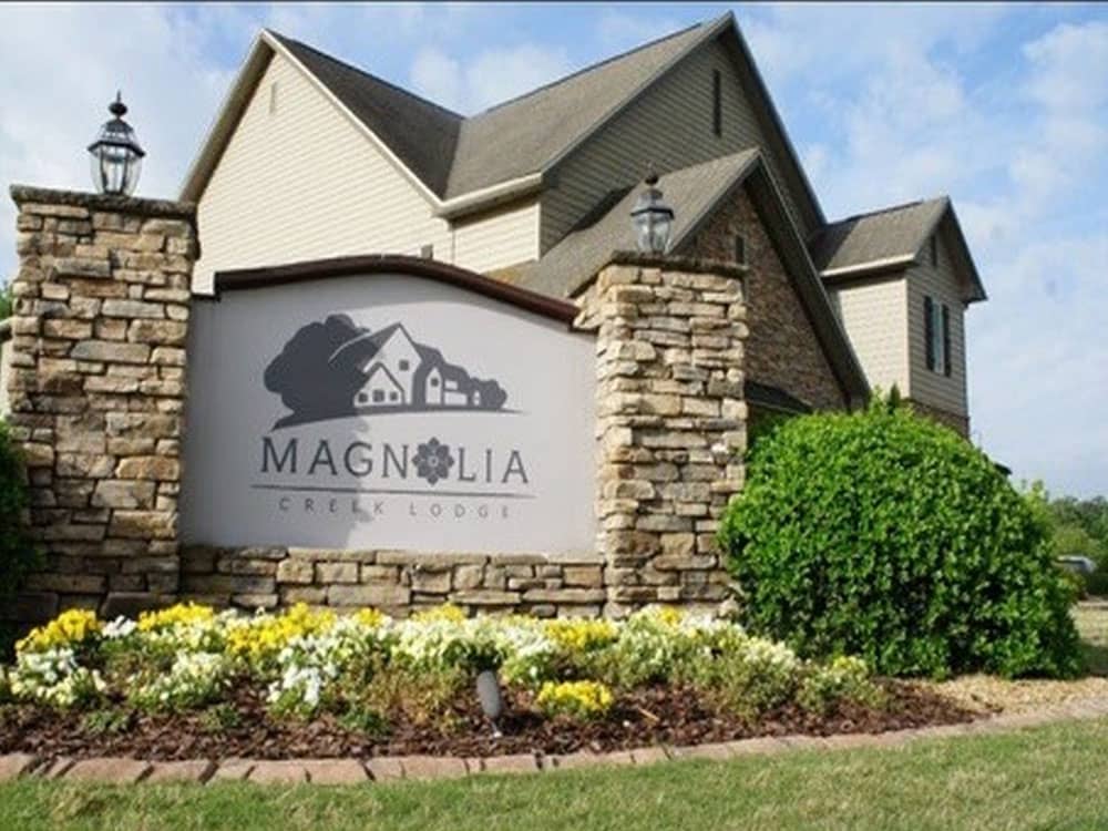 The park sign in front of a building