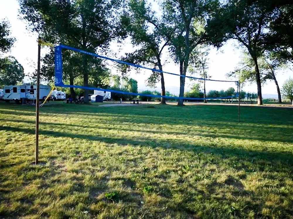 A volleyball net on the grass at ECHO ISLAND RV RESORT