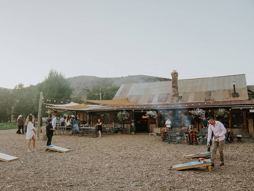 A couple playing cornhole