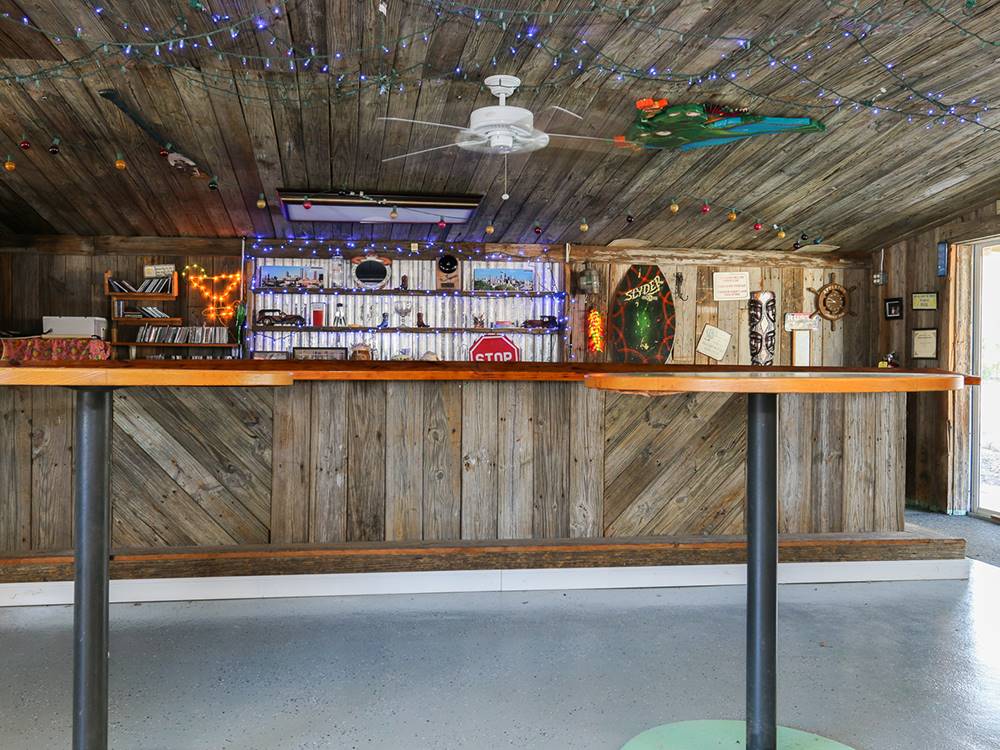 Wood paneled bar with decor at The Oaks at Zephyrhills