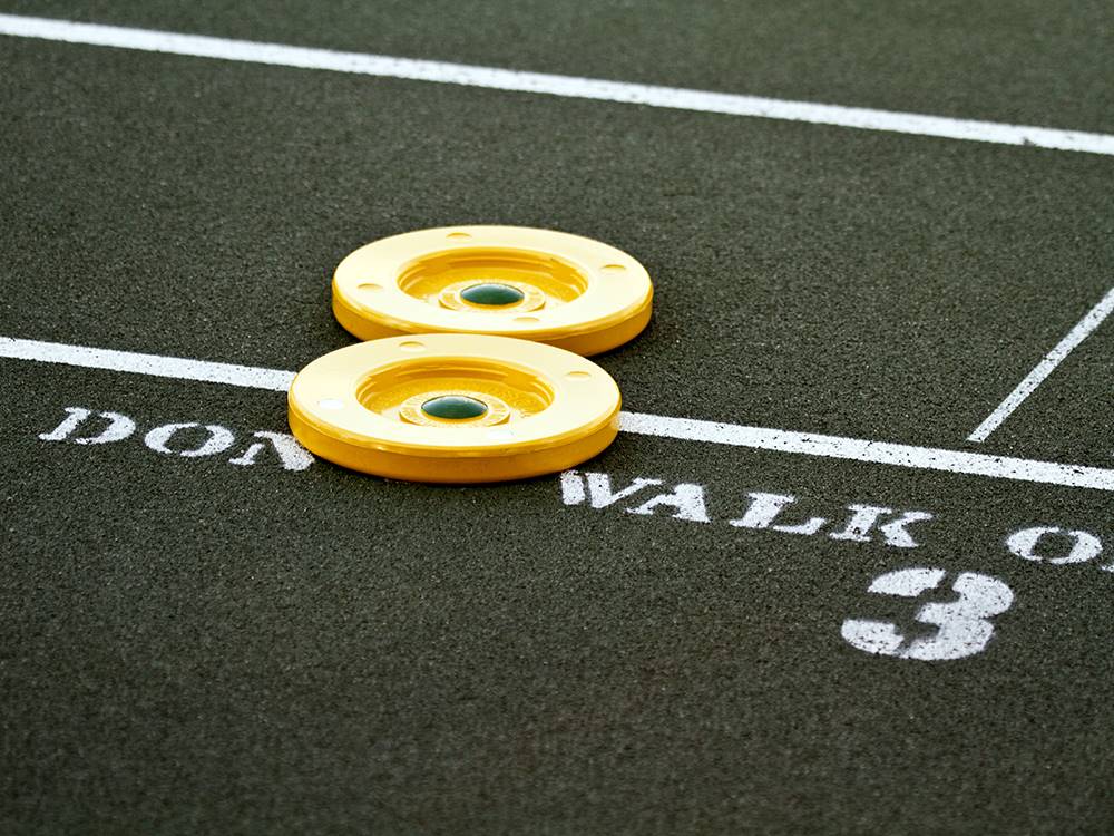 Shuffleboard and pieces to play at The Oaks at Zephyrhills