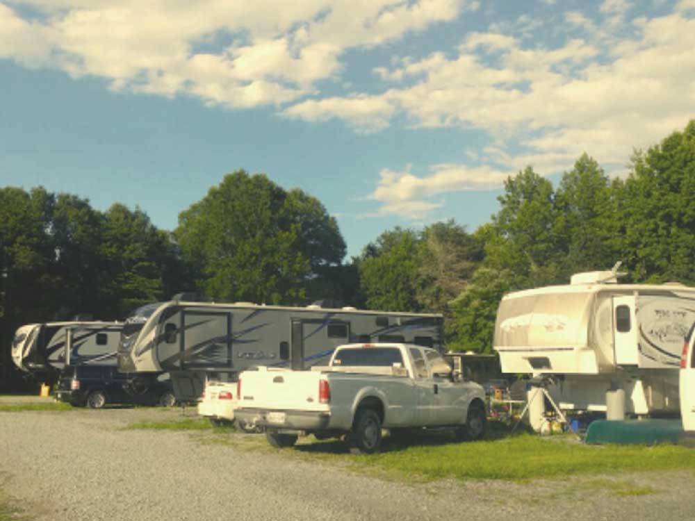 Trailers parked in grassy sites at SPRING CITY RV PARK