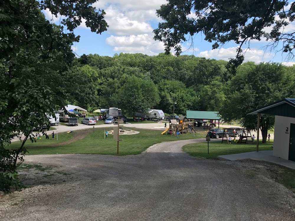 Gravel road winding through campground at SHADY BROOK CAMPING  RV ADVENTURES