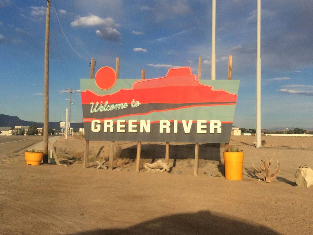 A welcome to Green River sign nearby