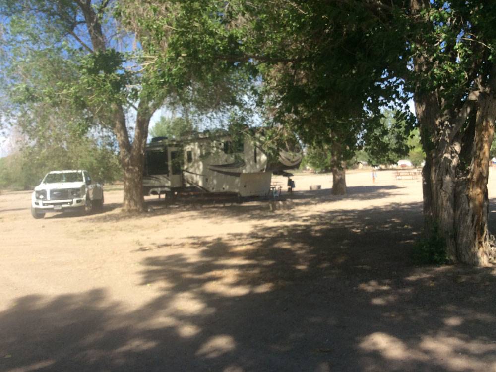 A fifth wheel parked in a gravel site