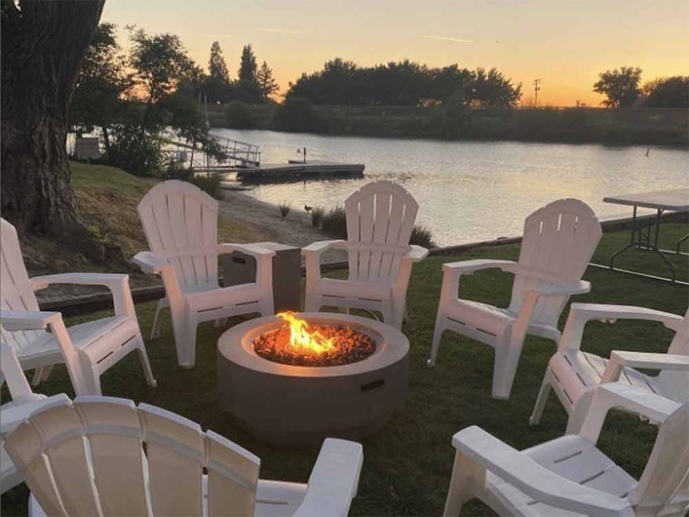 A circle of chairs around a fire pit at KO-KET RESORT