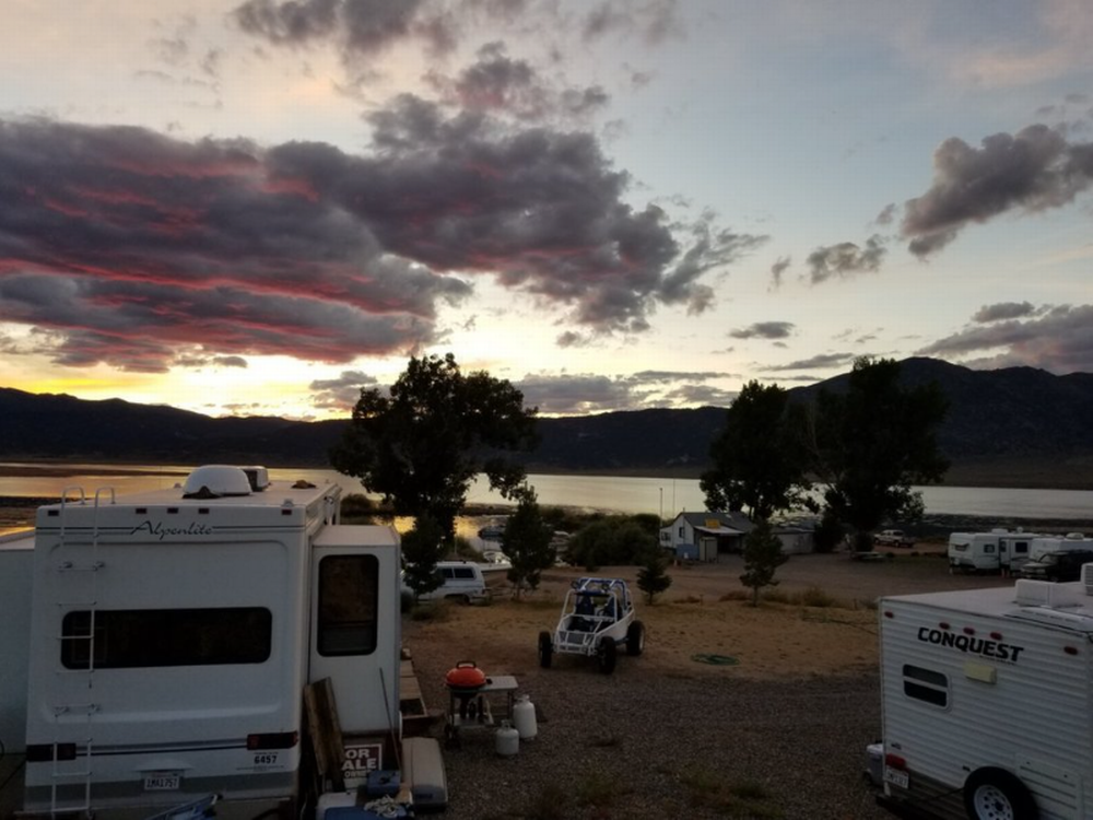 RV sites with lake in the distance at Bridgeport Reservoir Marine and Campground