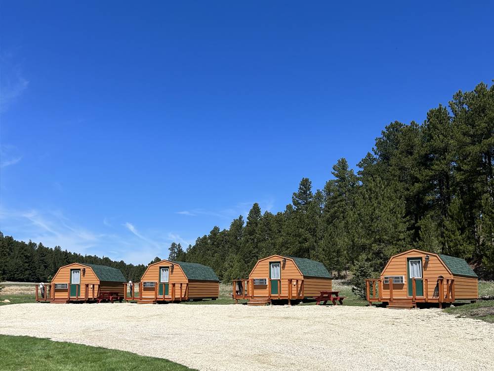 A row of the rental cabins at CUSTER CROSSING FAMILY CAMPGROUND