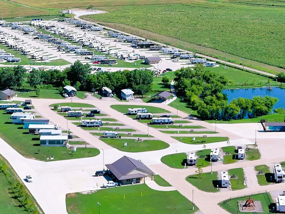 Birdseye view of the RV sites and pond at TEXAS RANCH RV RESORT