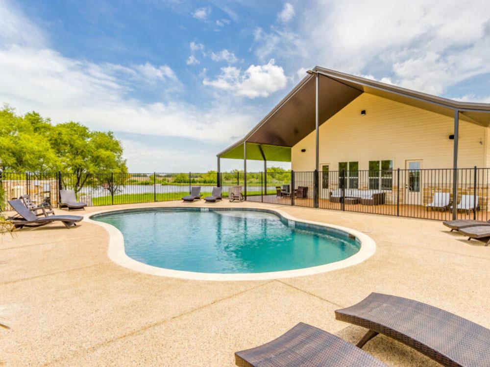 The small kidney-shaped pool at TEXAS RANCH RV RESORT