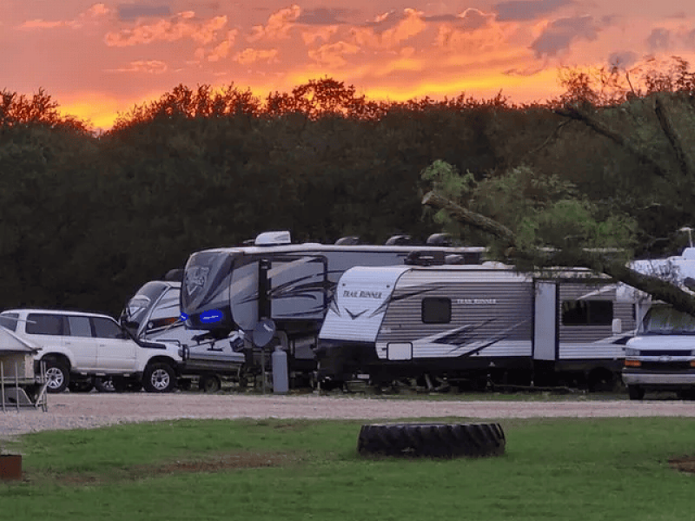 RVs in sites at sunset