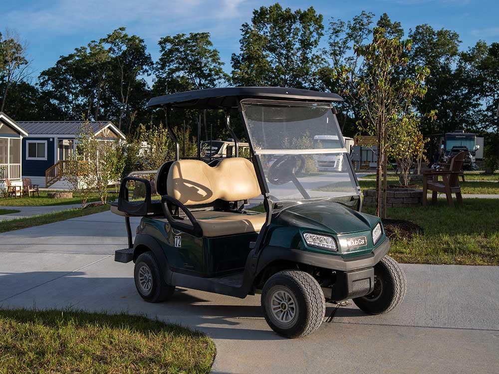 A golf cart parked next to the cabin rentals at LURAY RV RESORT & CAMPGROUND ON SHENANDOAH RIVER