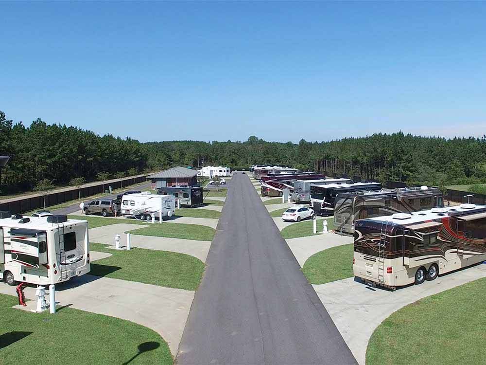 Brown, white and tan motorhomes parked at RV site at WIND CREEK ATMORE CASINO RV PARK