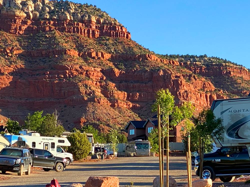 RVs parked in backed in sites at GRAND PLATEAU RV RESORT AT KANAB