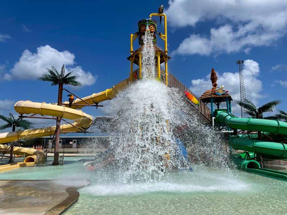 Colorful water slides with tiki water bucket at SUMMER BREEZE USA KATY