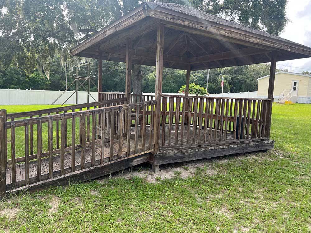 A wooden gazebo in grass at LOST LAKE RV PARK