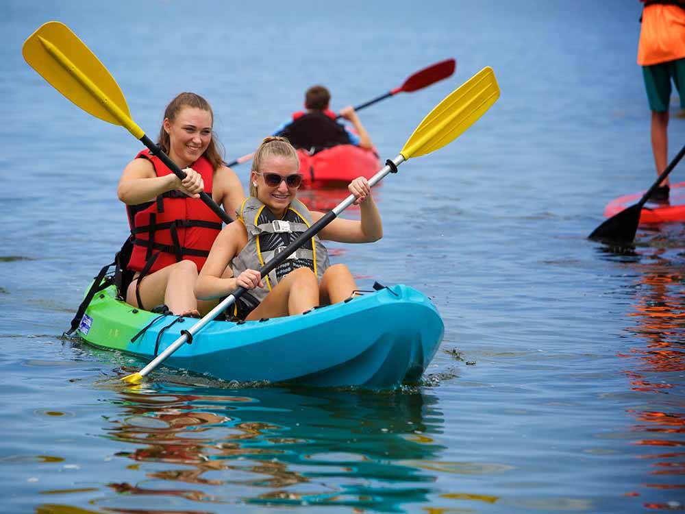 Two young ladies in a kayak at OUTER BANKS WEST/CURRITUCK SOUND KOA HOLIDAY