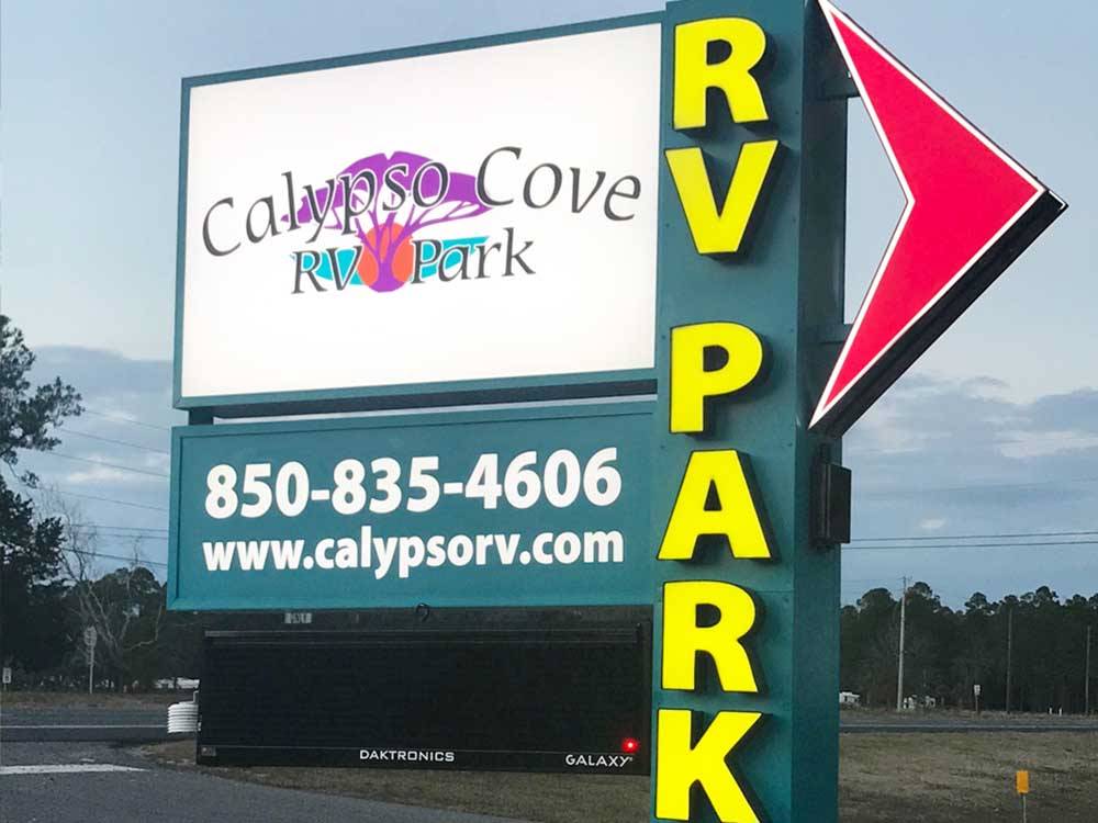 The large sign near the entrance at CALYPSO COVE RV PARK