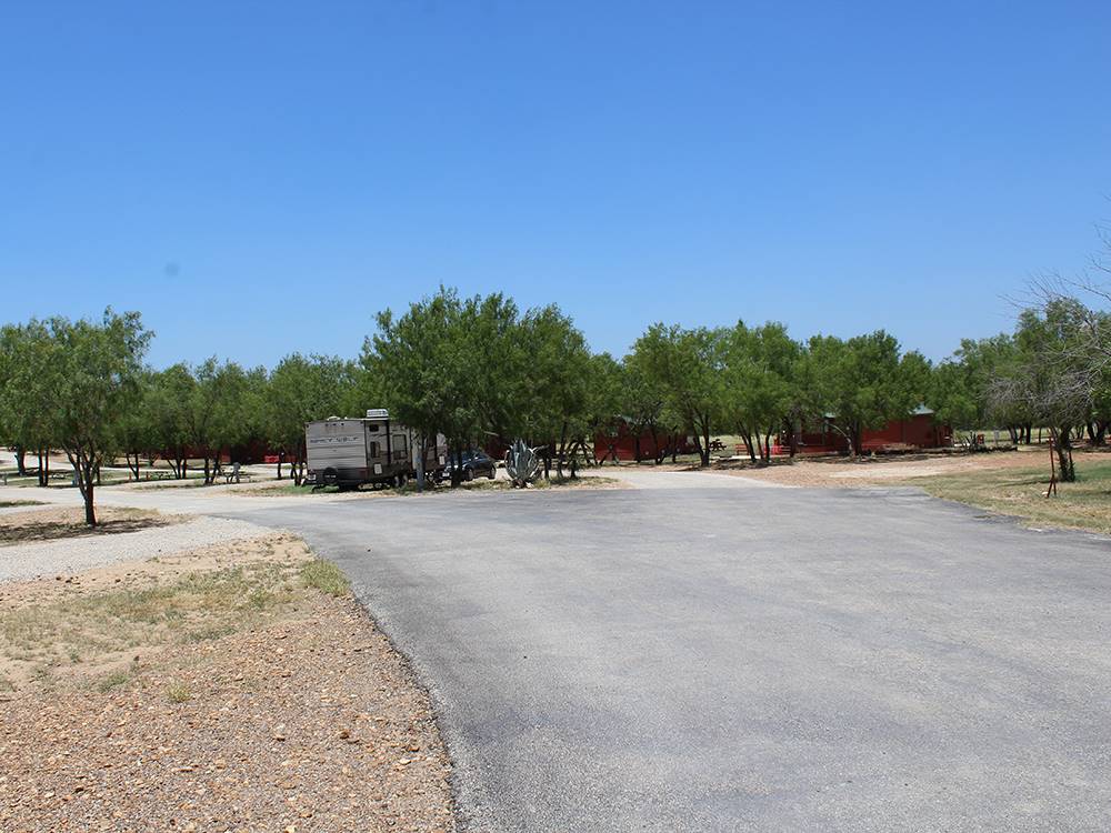 Paved road leading to sites at Cotulla Camp Resort