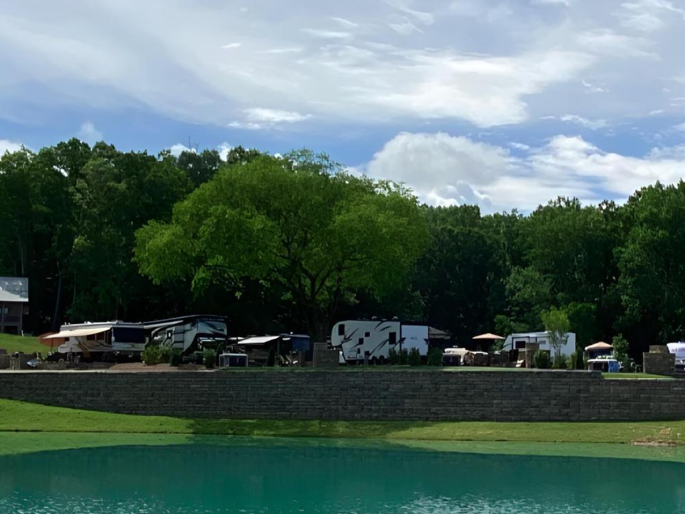 RV's parked next to lake at The Ridge Outdoor Resort