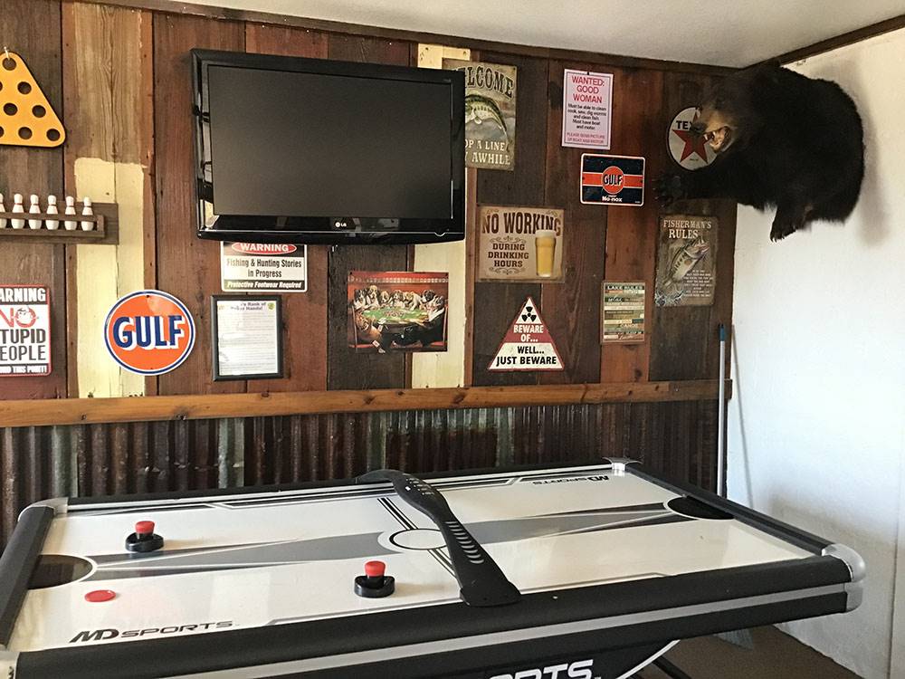 The game room with air hockey at Amigo Inn & RV Park