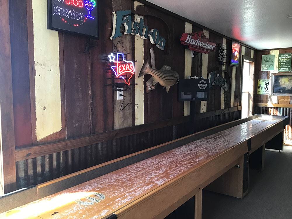 Indoor shuffleboard in the game room at Amigo Inn & RV Park